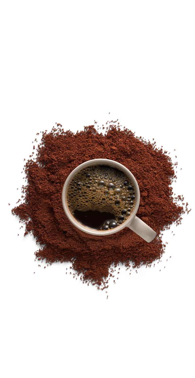 Cup resting on fresh coffee grounds